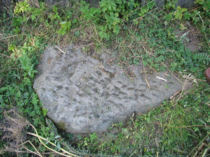 Buried Tombstone at
                  Bohorodchany Cemetery