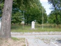 Jewish Cemetary ground surrounded by a fence.  The fence and commemorative tombstone were donated by Mr. Pesach Tunkelshwartz