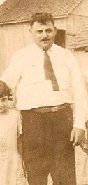 Louis (Levi) Platensky. Louis was a blacksmith in Stavisht. Most likely this photo was taken in the U.S. and those are his daughters beside him, circa 1914. <em>Photo submitted by Paul Schnee.</em>