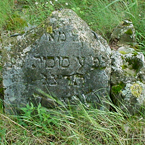 (top of stone broken off)