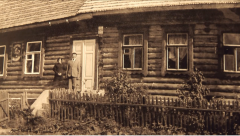 couple in front of wood bldg